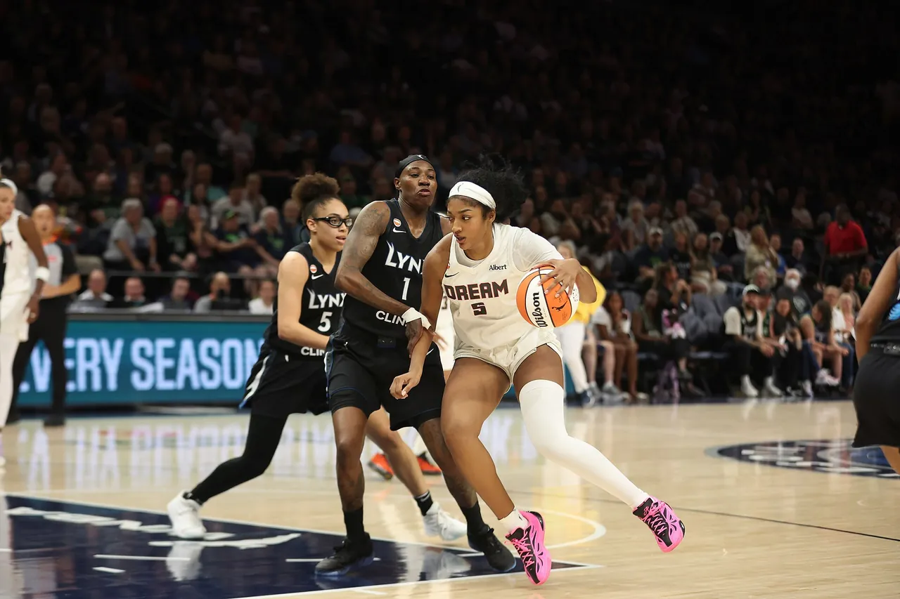 Angel Reese of the Atlanta Dream drives past Minnesota Lynx defenders in May 2026