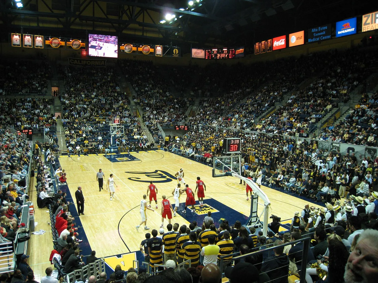 Pete Newell Court at Haas Pavilion in Berkeley during a Cal home game, with retired jerseys hanging above the seats