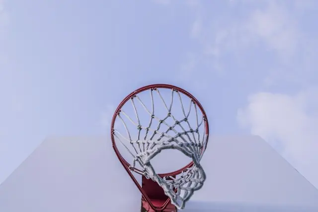 A red rim and white net seen from directly below